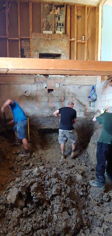 Underpinning a house foundation. Blue Clay