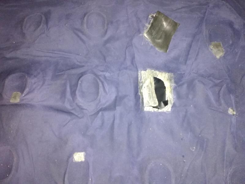 Six patches over seven holes; "last straw" hole at centre-right