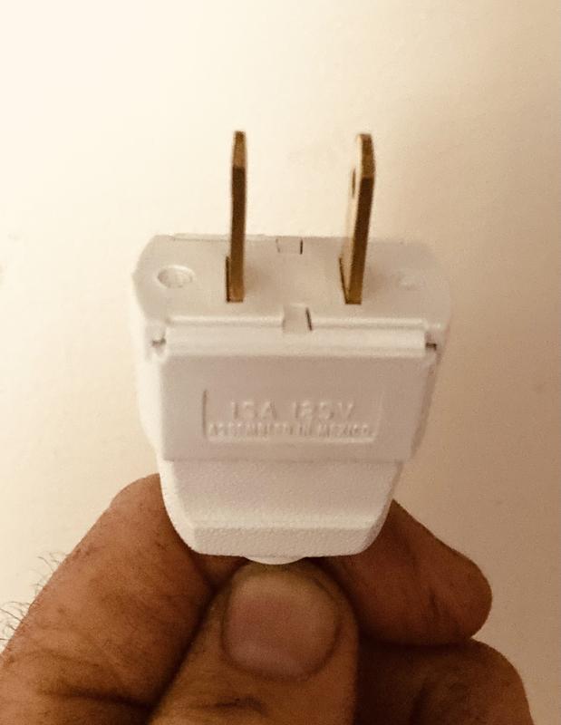 Comparing sizes of Leviton with a regular plug.