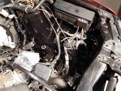 Ford Escape, under the battery and air filter area.