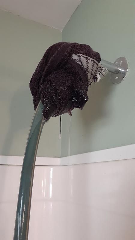 Towel wrapped to control the water spraying out from between the fittings