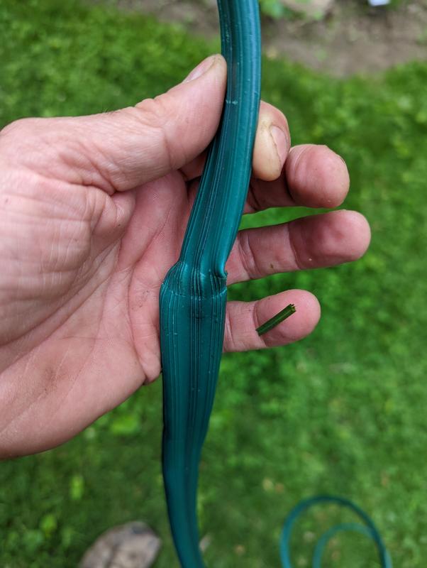 Crimps on hose from bands holding it to package.