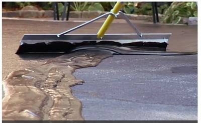 spreading resurfacer with a squeegee on large surfaces