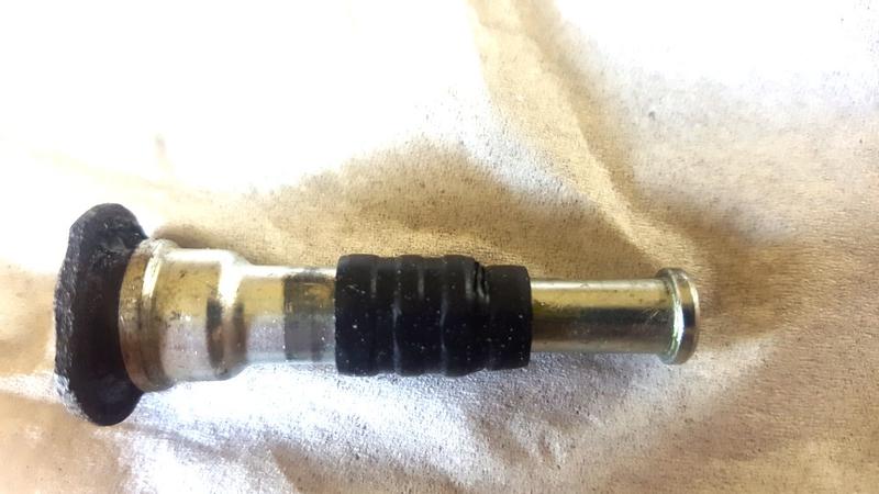 Rubber is swelled so it's loose and floppy, allowing it to slide up like this. It's supposed to stay to the right, in the narrow spot.