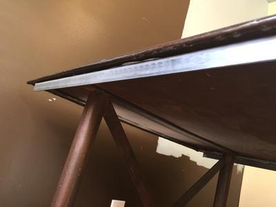 Table after fix Using JB weld (angle iron bonded to table)