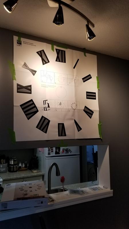 Stencil on wall with pieces placed