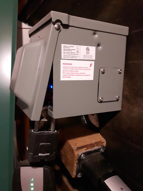 Locked 50A RV & EV Outdoor Charging Outlet #040-1984-6 with EV charger plug and 50A 3150J RV & EV Surge Protector #040-1986-2