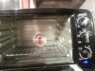 Thermometer in oven - note dial at 350 and temp reading at 450.