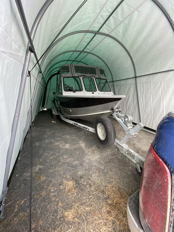 front view of the boat with part of my truck inside the shelter with it during the parking process. You can see the ample height clearance as well for the shelter. Remember door height is less than shelter height.