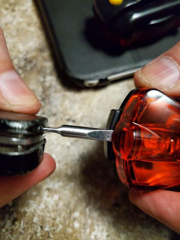 The back light is straight forward, insert here and pry red lens from the black body, either side.