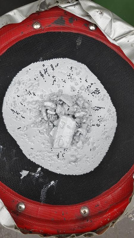 The strainer I made to remove the lumps in an attempt to use the product.