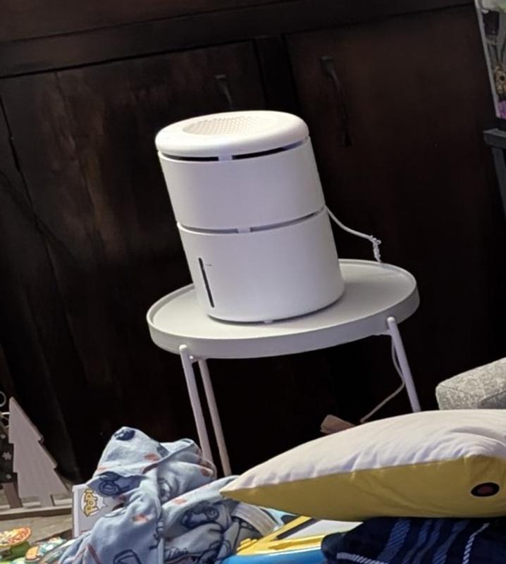 Unit sitting on small table.