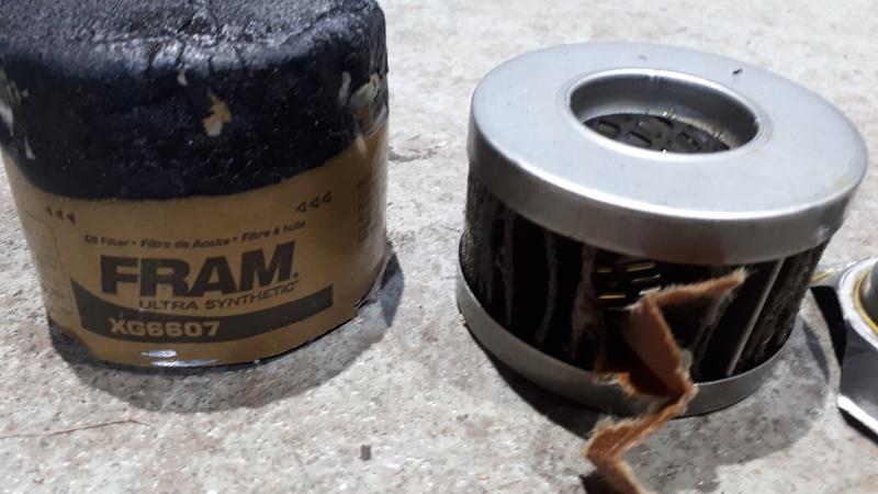 Filter cut open. Single layer filter media instead of dual layer, lack of seals on ID of end cups.