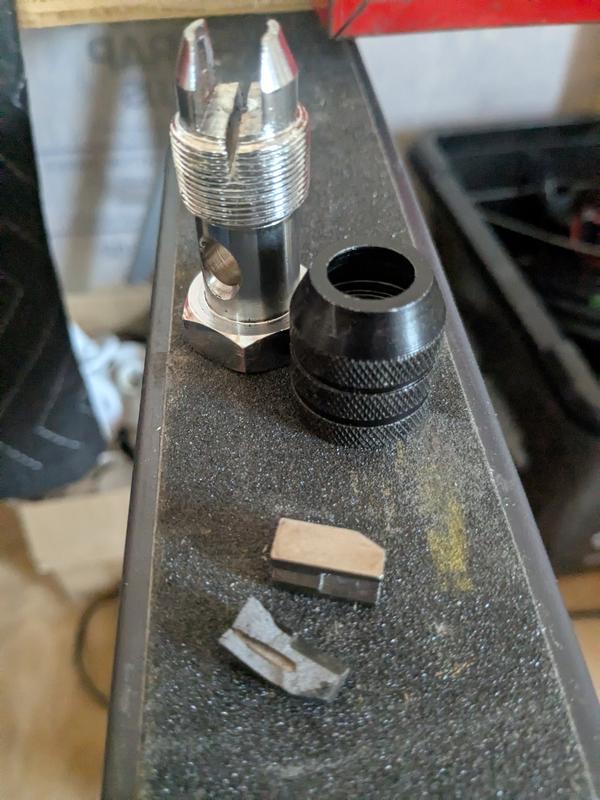 Broken tap wrench grip finger.