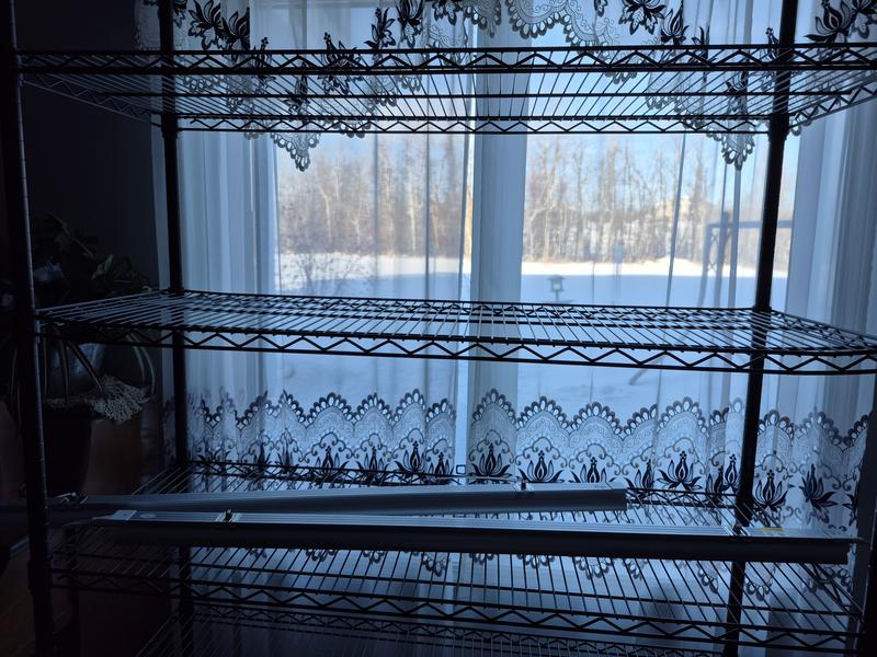 Middle shelf bent at each end.