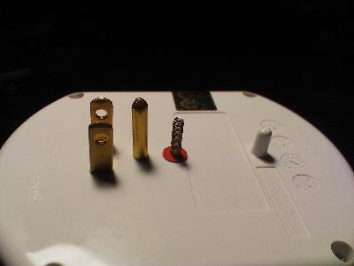 The mounting screw and alignment peg.