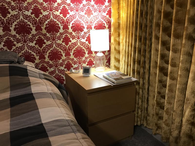 Adds a modern glow to our wallpaper and drapes.