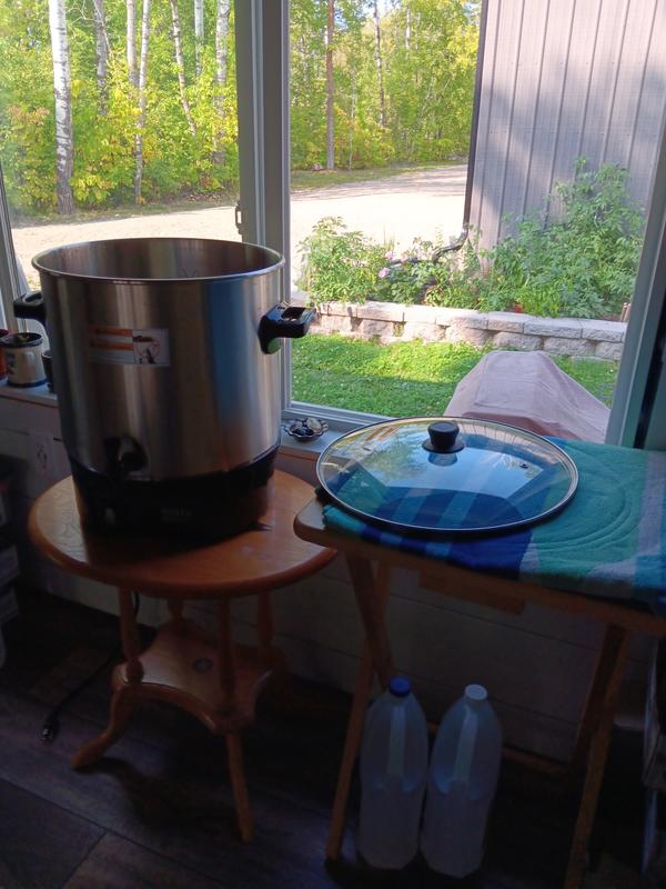 Have it on a low table with another table to hold the lid/jars.