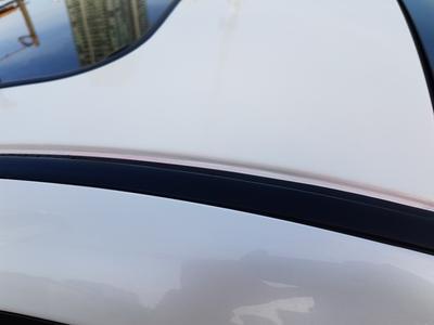 Washer fluid dried and caked on white paint