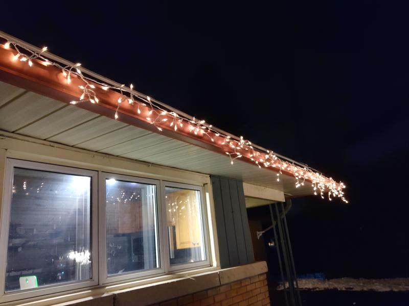 Half on left, stiff unbendable icicles, half on right, my old lights that hang lower.
