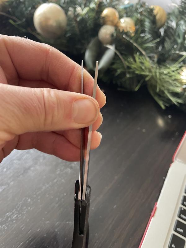 Doesn't take any force to pull the blades apart. Makes cutting anything harder than paper almost impossible.