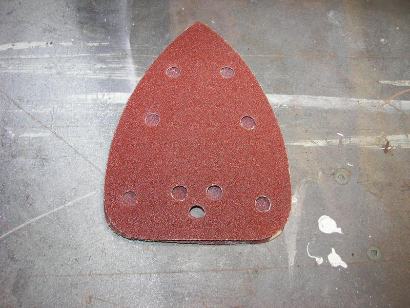 New sandpaper on top of old showing no aligned holes