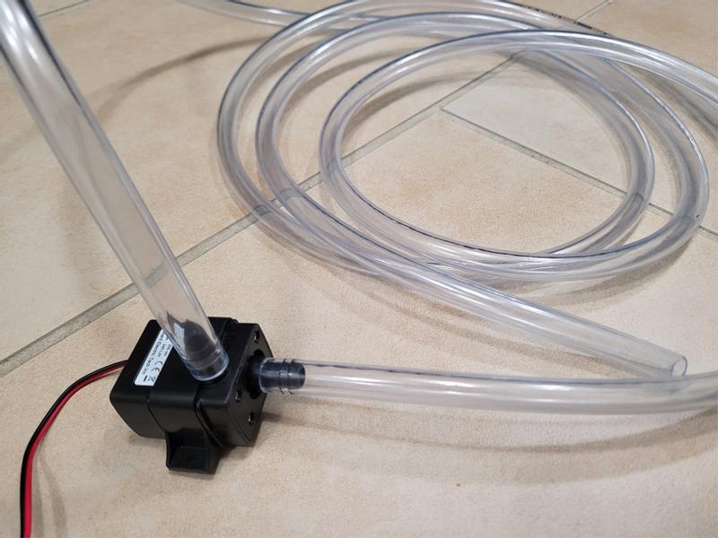 This hose fits nicely on the inlet and outlet of a mini water pump.