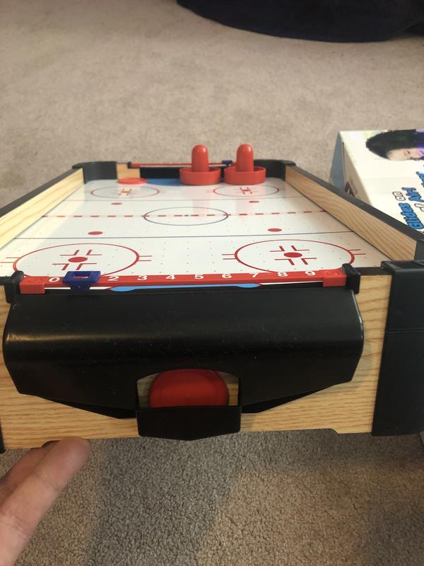 The hockey puck is difficult to get out