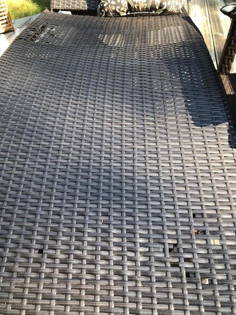 Very bottom of the chair.