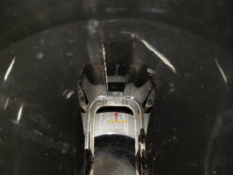 Carafe inserted but turned 45 degrees up against body of unit causing to be moved toward you