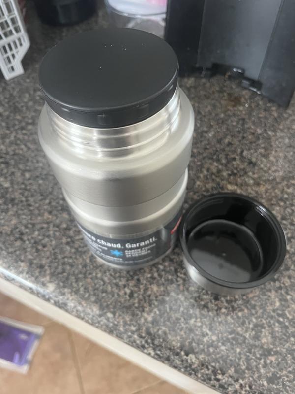 The smaller version has spoon built in to lid. As you can see no built in spoon