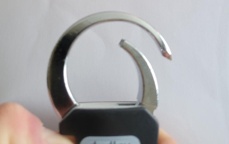 Lock opened as far as it will go, the small portion does not push in any further