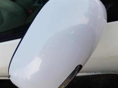 Pink hue and spots on side mirror