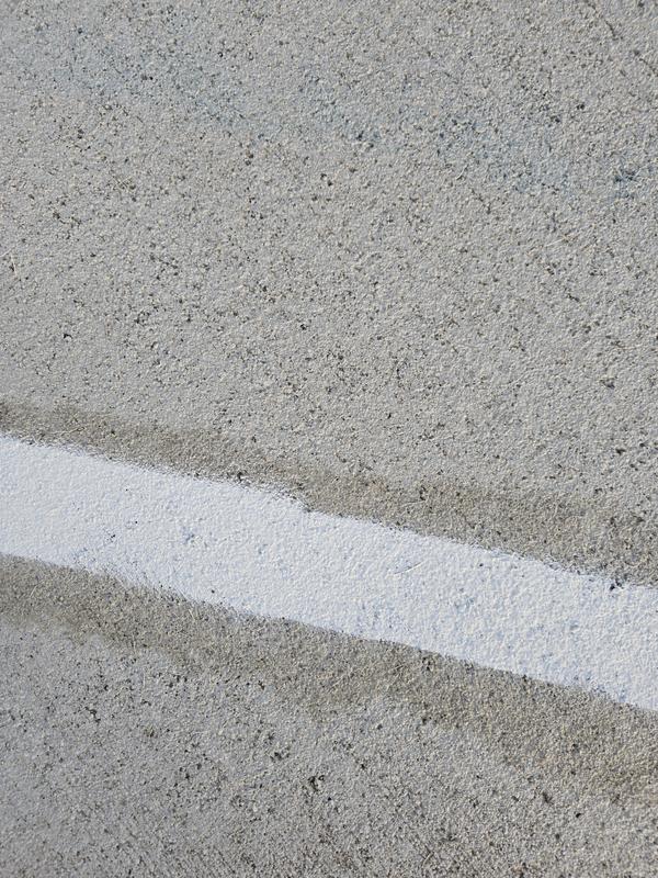 Dark overspray along paint