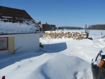 The chicken coop is behind how many snow drifts?