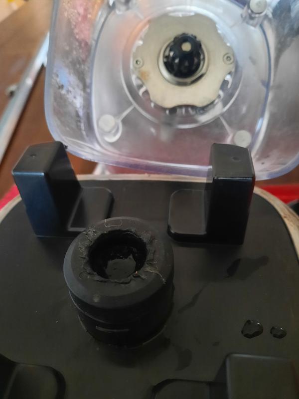 Completely stripped black plastic coupler on motor.