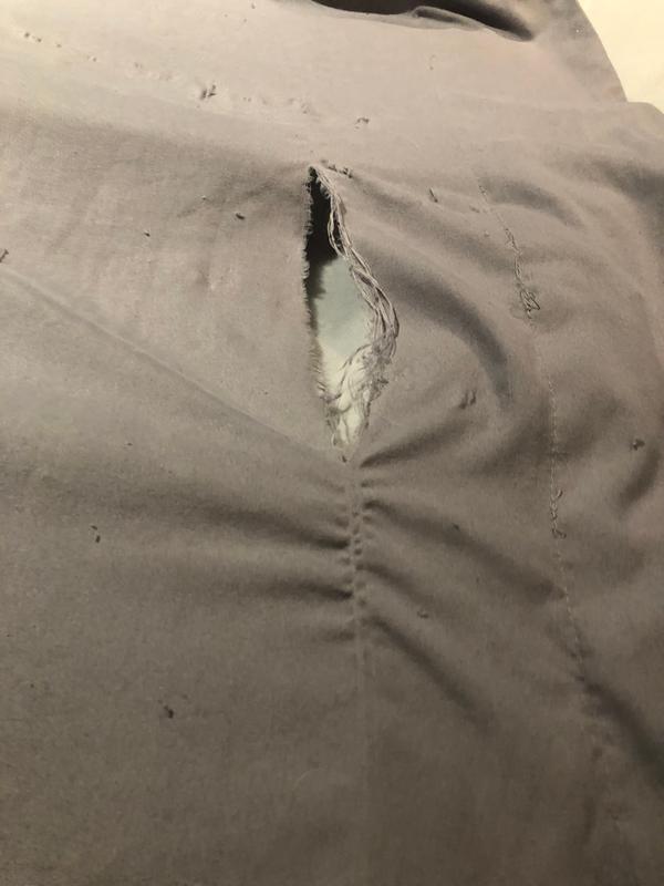 Top sheet has multiple holes, pulling and snags