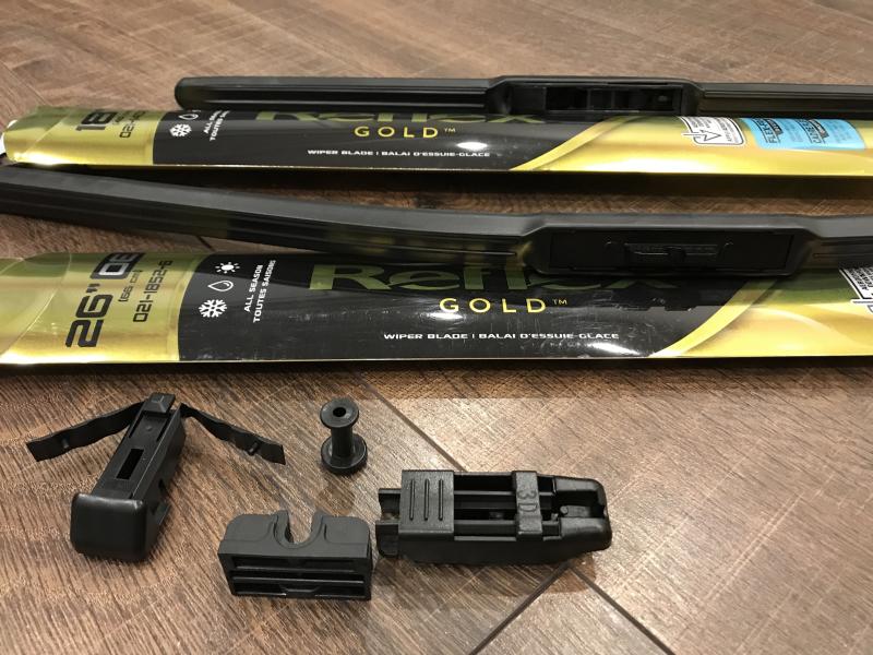 Above, the 18" wiper blade, compatible with hook arm types. Below, the 26" wiper blade with three non-fitting adapters.