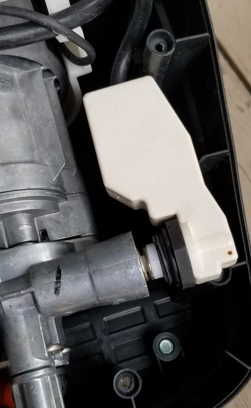 The black screw is plastic which screws into motor hosing