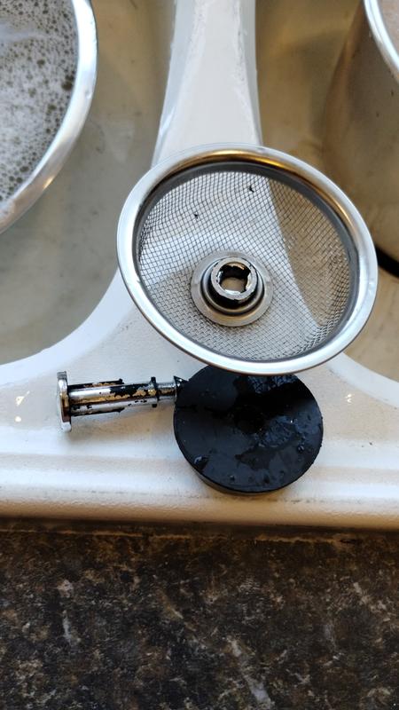 Note the lost chrome on the plastic spike, damaged rubber.