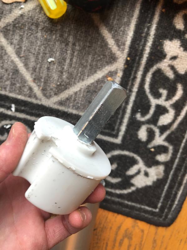 The square metal piece has come loose and spins when under the load of the spring arms.