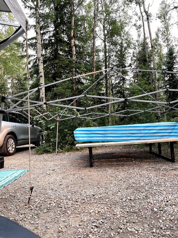 Half taken down for bad weather threat.  It's easy to put the tarp back on and push it up again. Not sure if it would rust though.