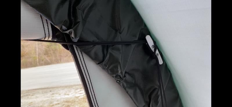 I installed the cleat for the ez roll up door kit nice and high to avoid hitting the rope with my boat - this is the top right hand corner of the shelter, as high as the top of the zipper in the door