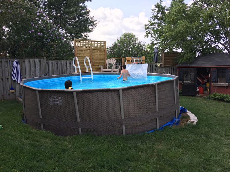 our pool with our new ladder and deck behind