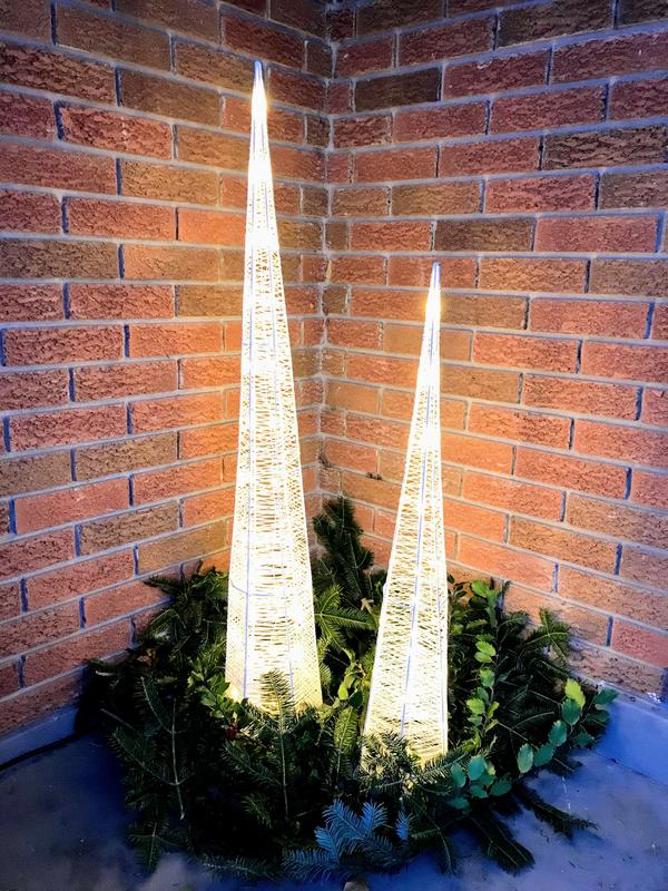 LED glitter cone trees on porch