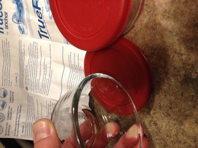 Broken glass lip upon opening.