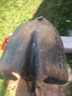 Back side of shovel showing name and how much of black paint was worn off, to show amount of use