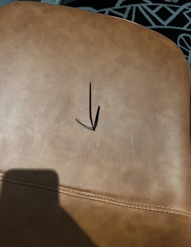 screw imprint on base of chair