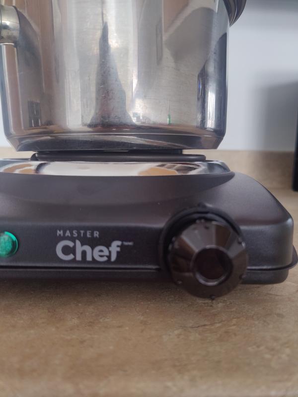 A droite on voit que le chaudron ne touche pas à l'élément chauffant.