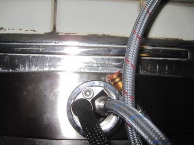 shows super tight squeeze to get feed line nut through not-quite-large-enough hole.